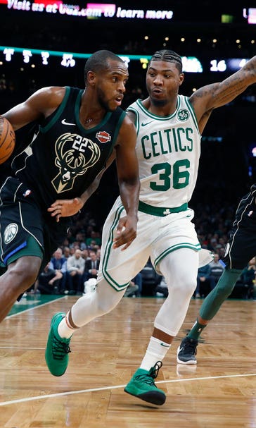 Irving scores 28, Celtics beat Bucks 117-113